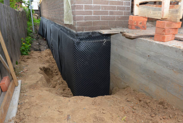 Happy homeowners after waterproofing job in Riva